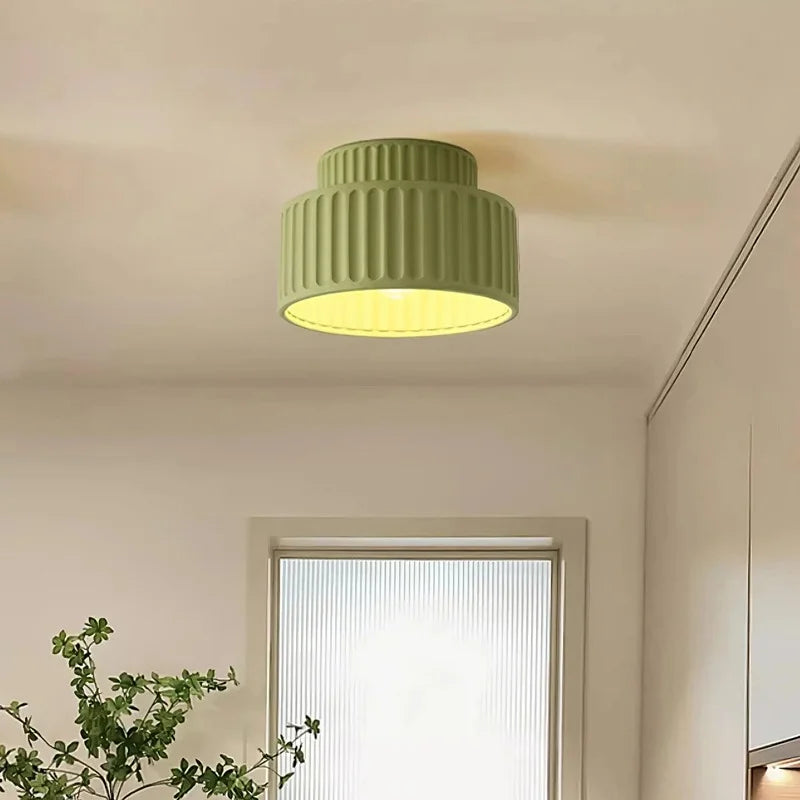 Fluted semi flush mount ceiling light shown switched off on a plain background