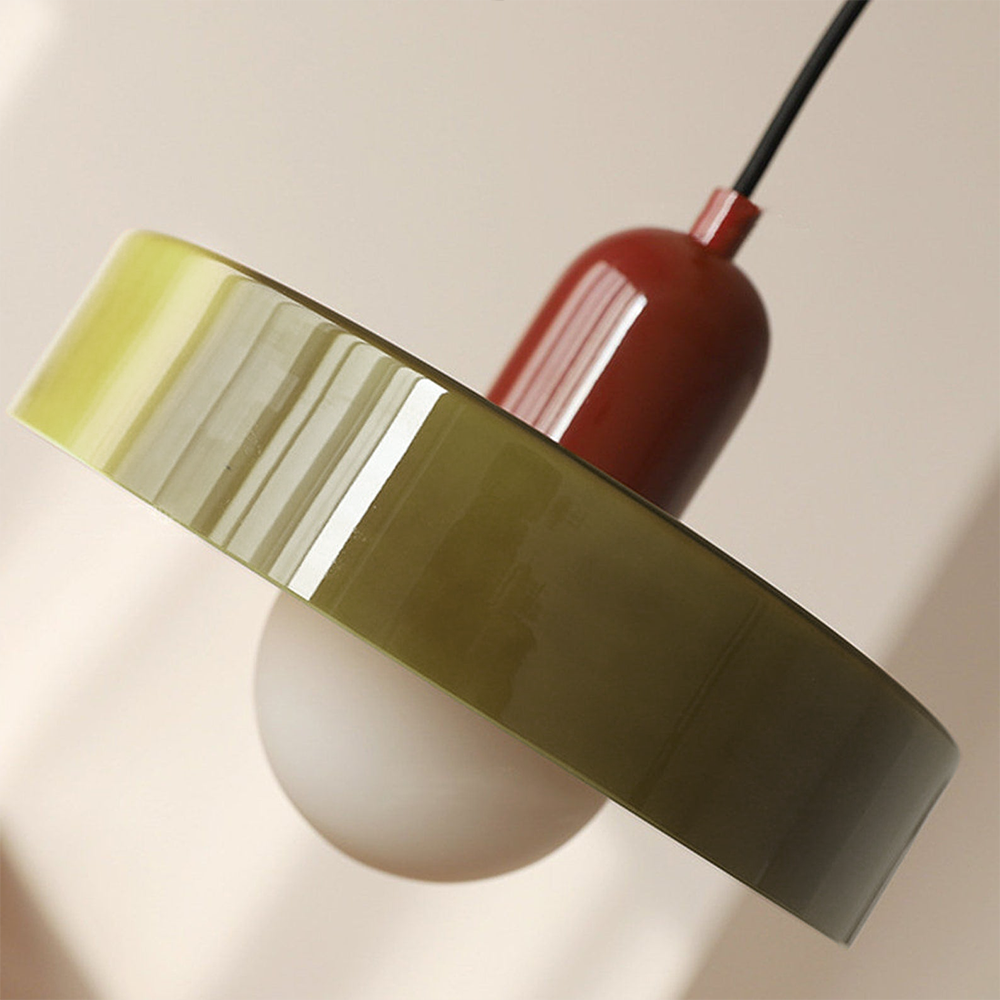 Close angled view of the fluted olive glass rim and red enamel lamp holder
