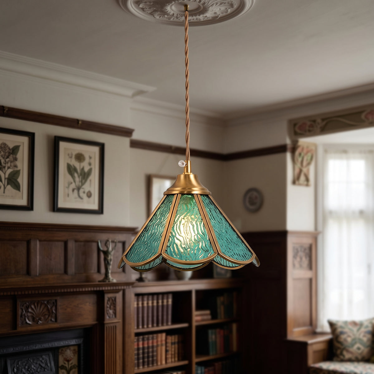 Blue panelled glass pendant with a scalloped brass frame lit in a panelled room