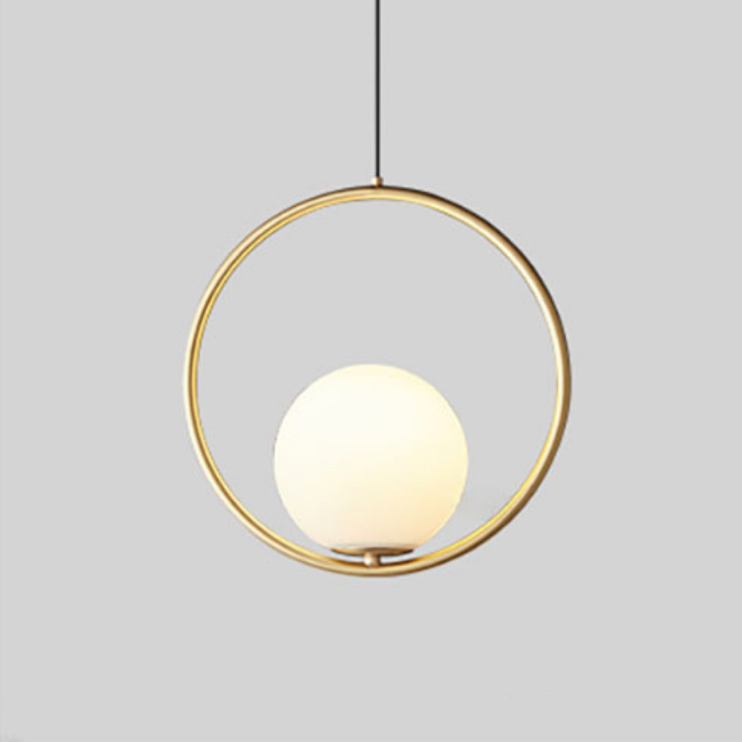 Gold round hoop pendant with a lit glass globe on a grey background