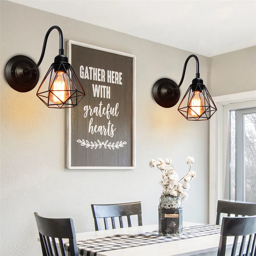 Pair of gooseneck cage wall lights providing warm ambient lighting