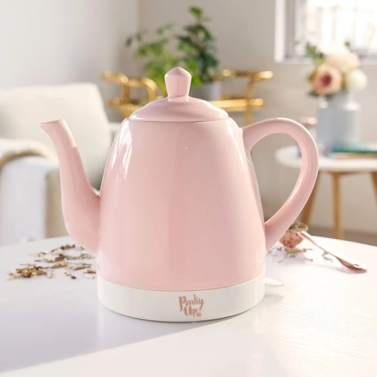 ceramic electric jug with glossy pink finish on kitchen counter