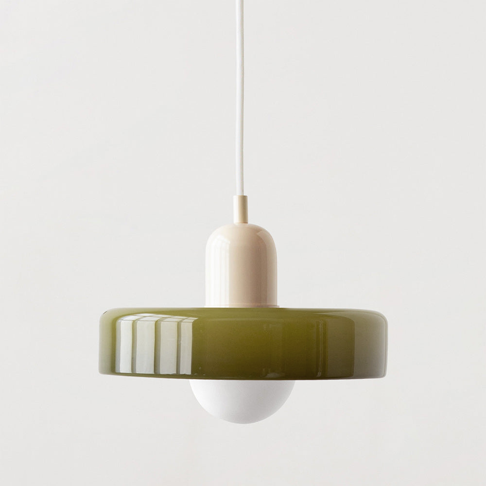 Olive glass disc shade with a beige lamp holder suspended on a white cord