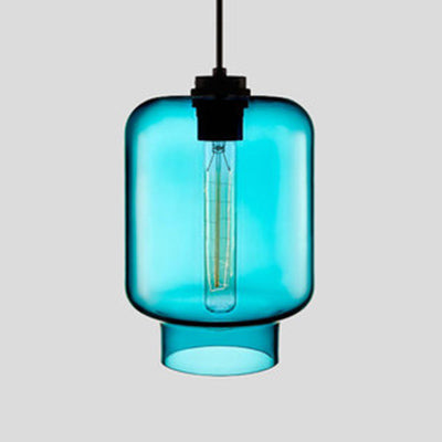 Blue tapered glass pendant with a black cap, lit against grey