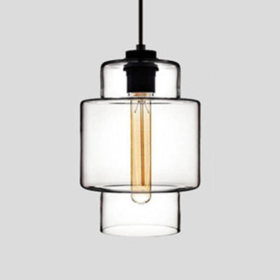 Clear stepped glass pendant with a wide upper band, shown lit