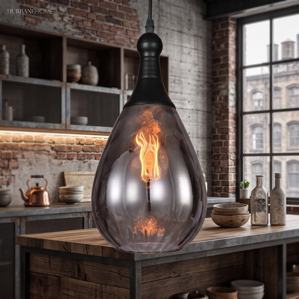 Smoke glass teardrop pendant above a kitchen bench and open shelves