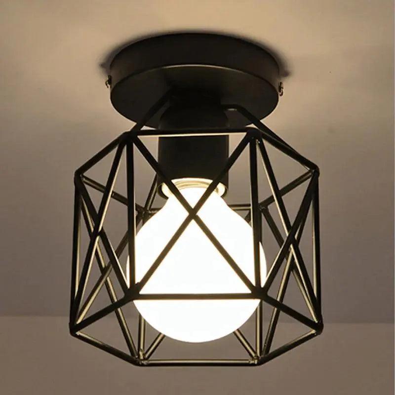 Close view of the open metal cage and its exposed globe bulb