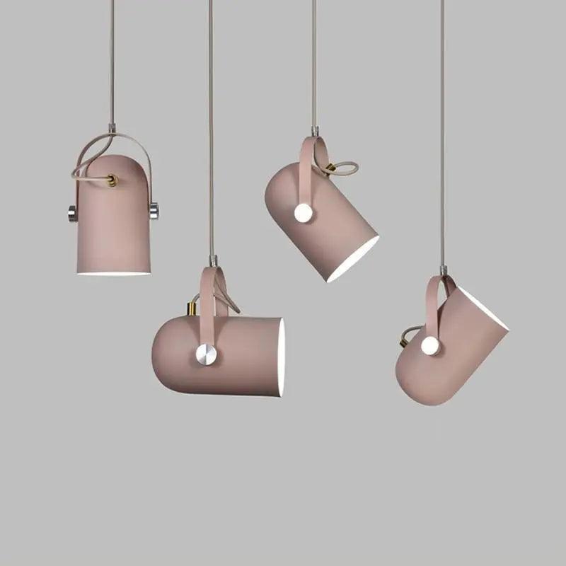 Four pink pendants shown at different heights and tilt angles