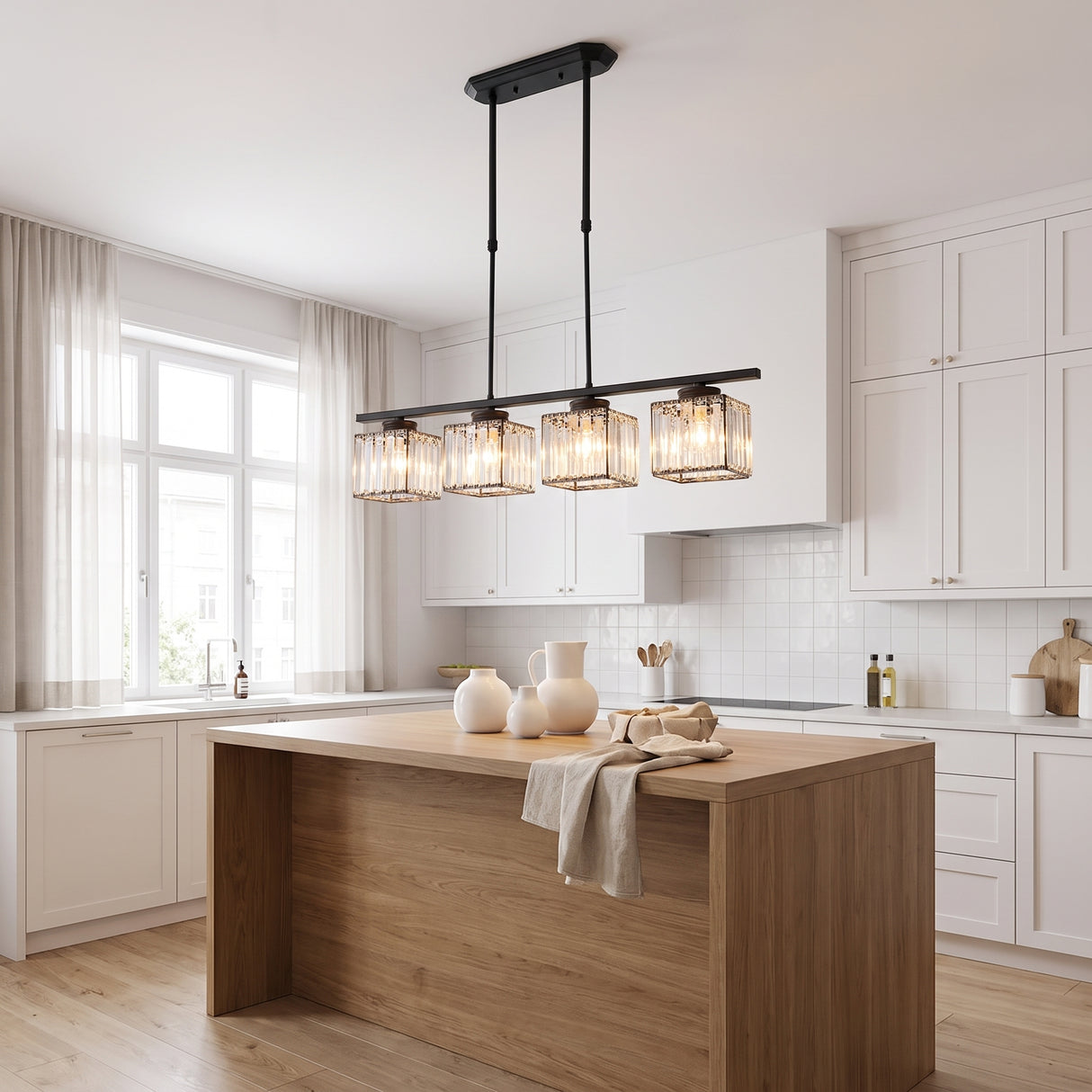 Kitchen island pendant light in black over a timber island in a white kitchen