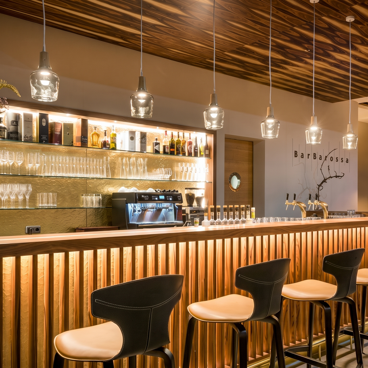Clear glass pendants in a long row above a timber bar front