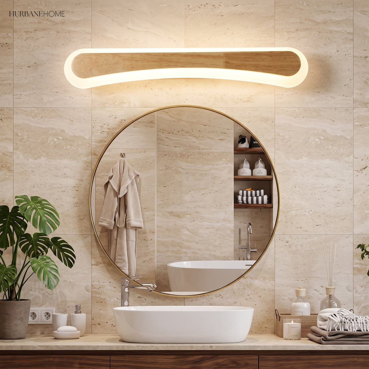 Curved wood vanity light lit above a round mirror and vessel basin