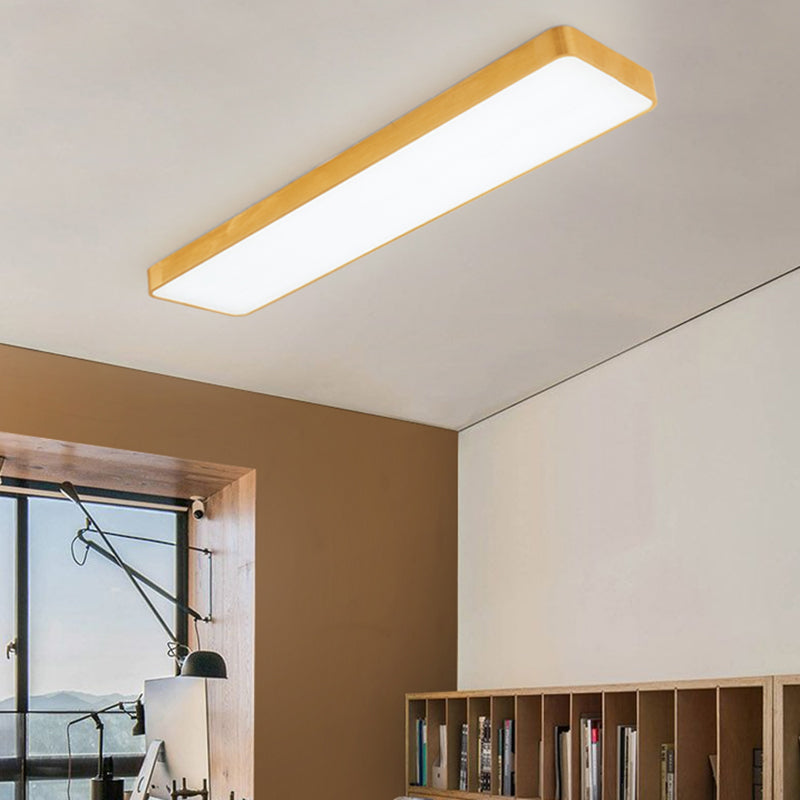 Gold LED ceiling panel fitted to a sloped ceiling above a study