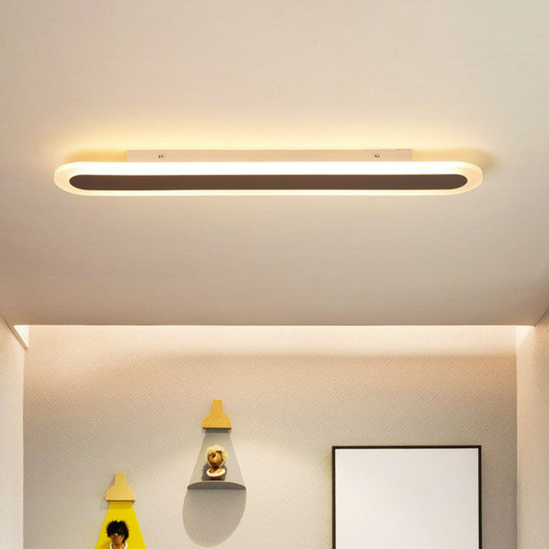 White linear ceiling light in a bright child bedroom