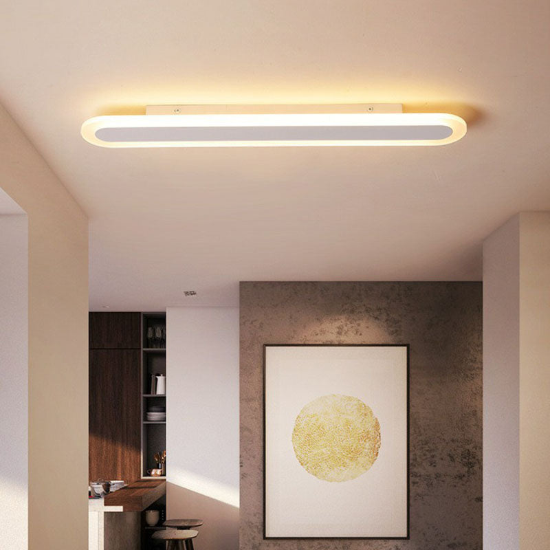 White ceiling light in a room with dark timber joinery