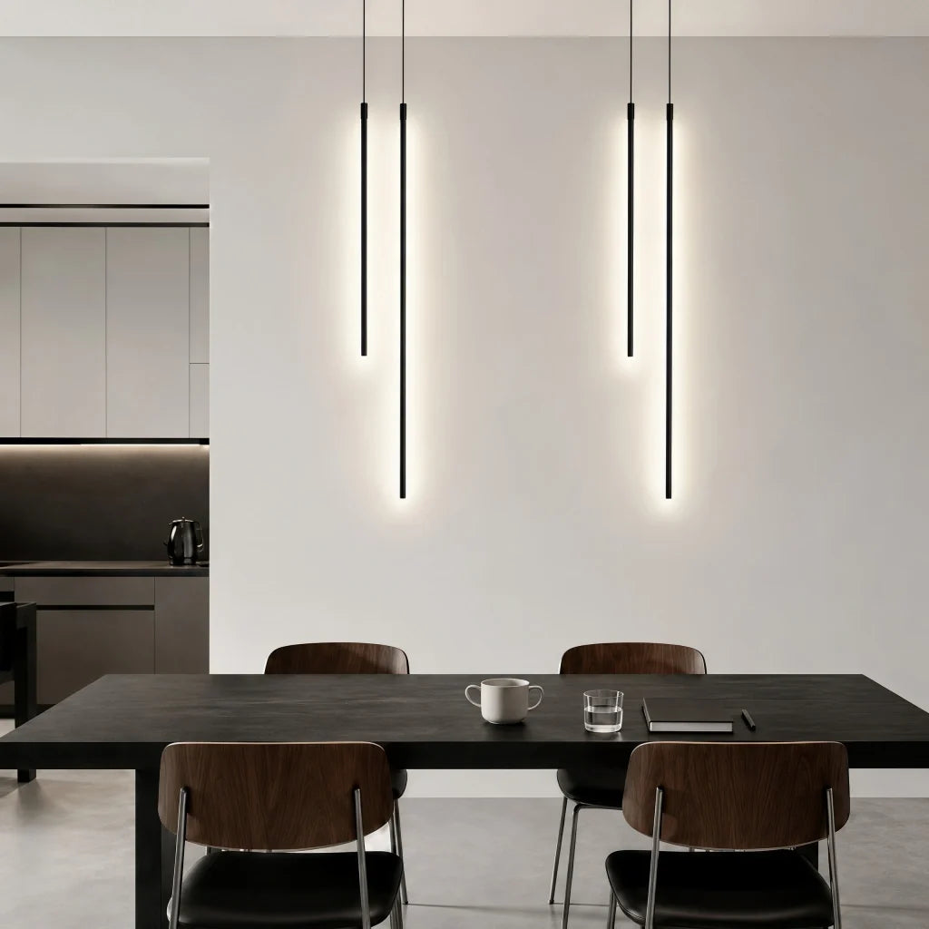 LED linear pendant light suspended above a dining table