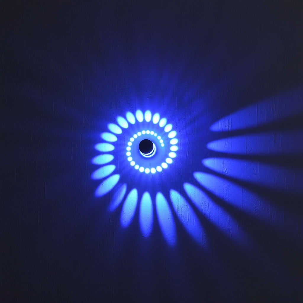 Close view of a blue spiral pattern thrown across a wall