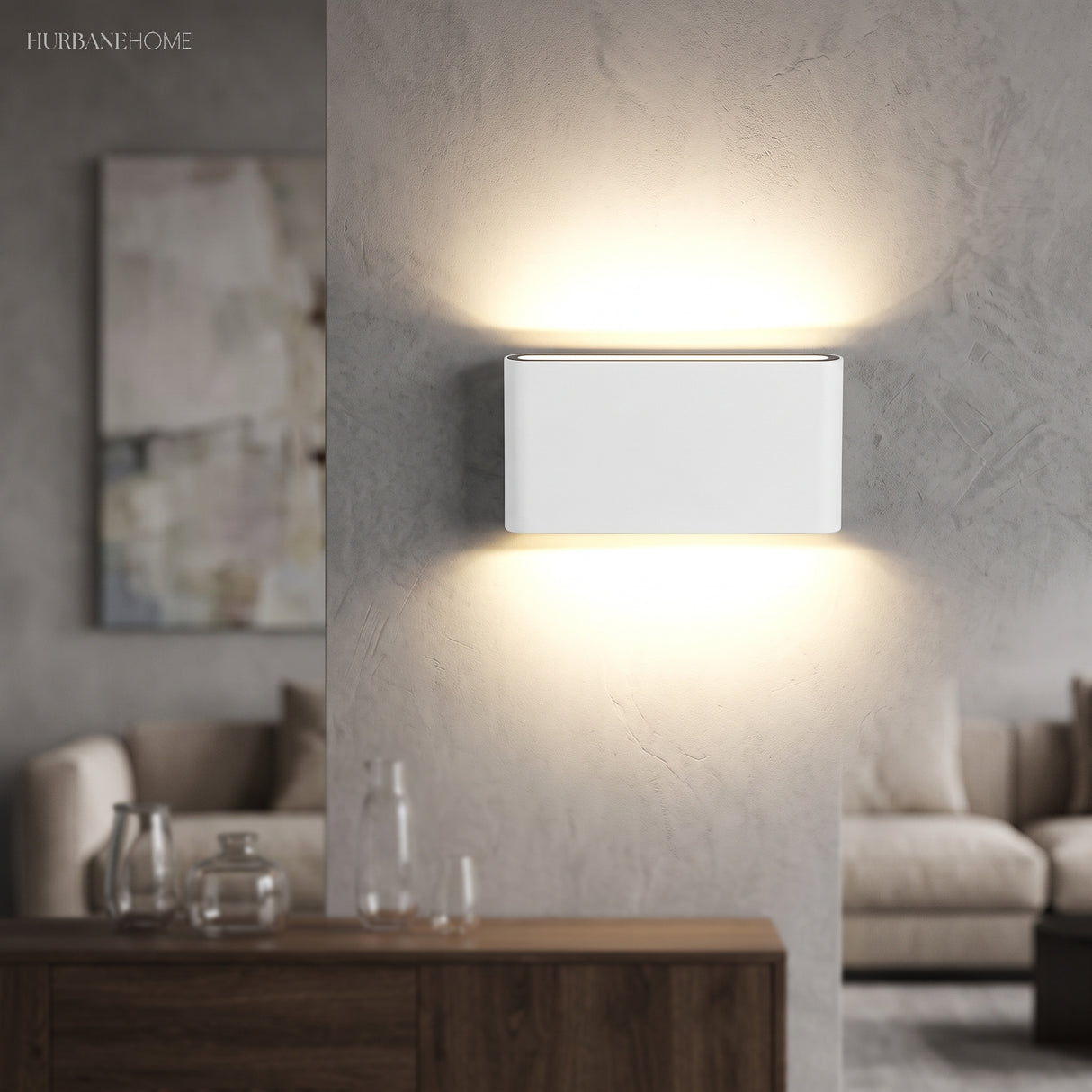 White LED wall sconce glowing above a console in a living room