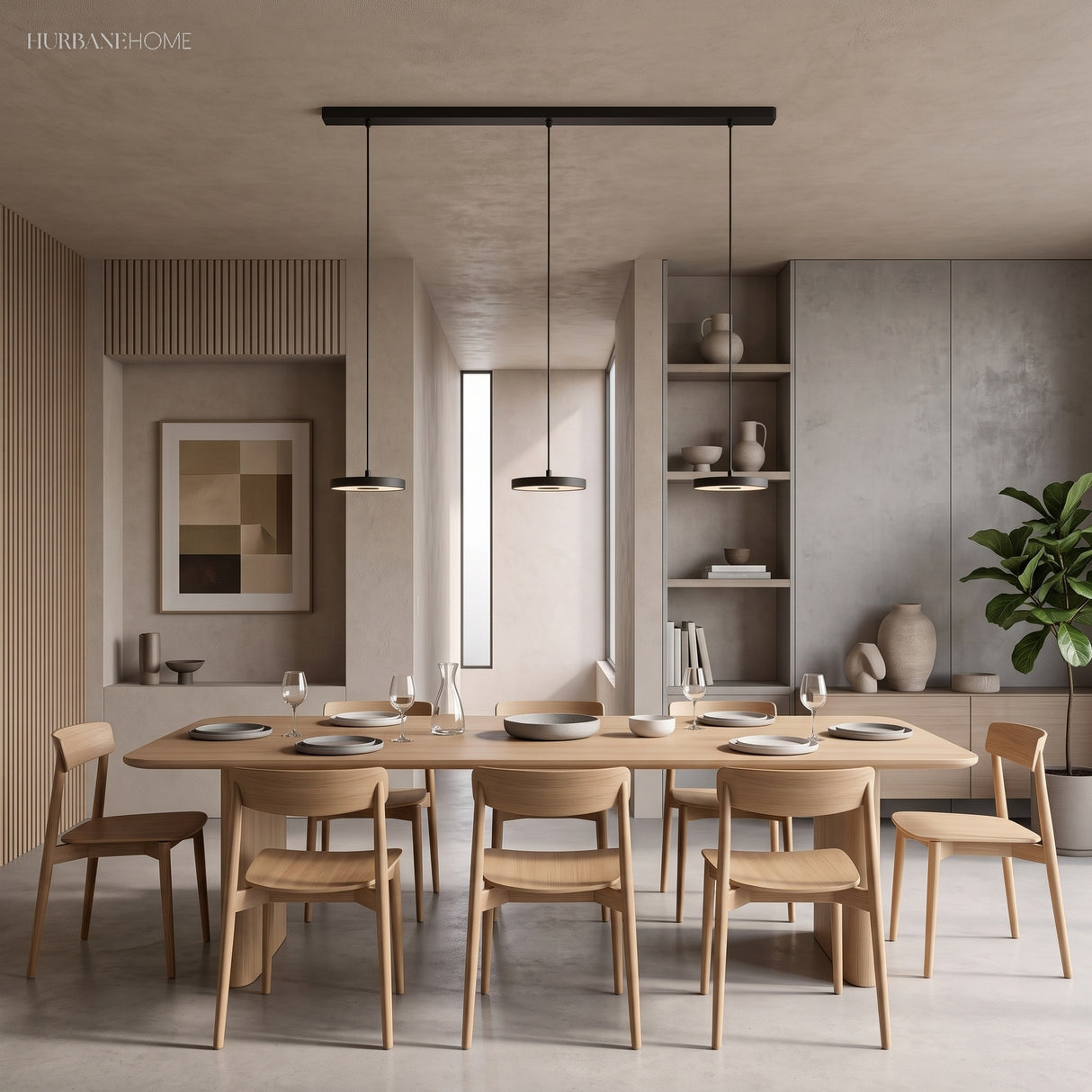 Two black disc pendants glowing over a light oak dining table set for dinner