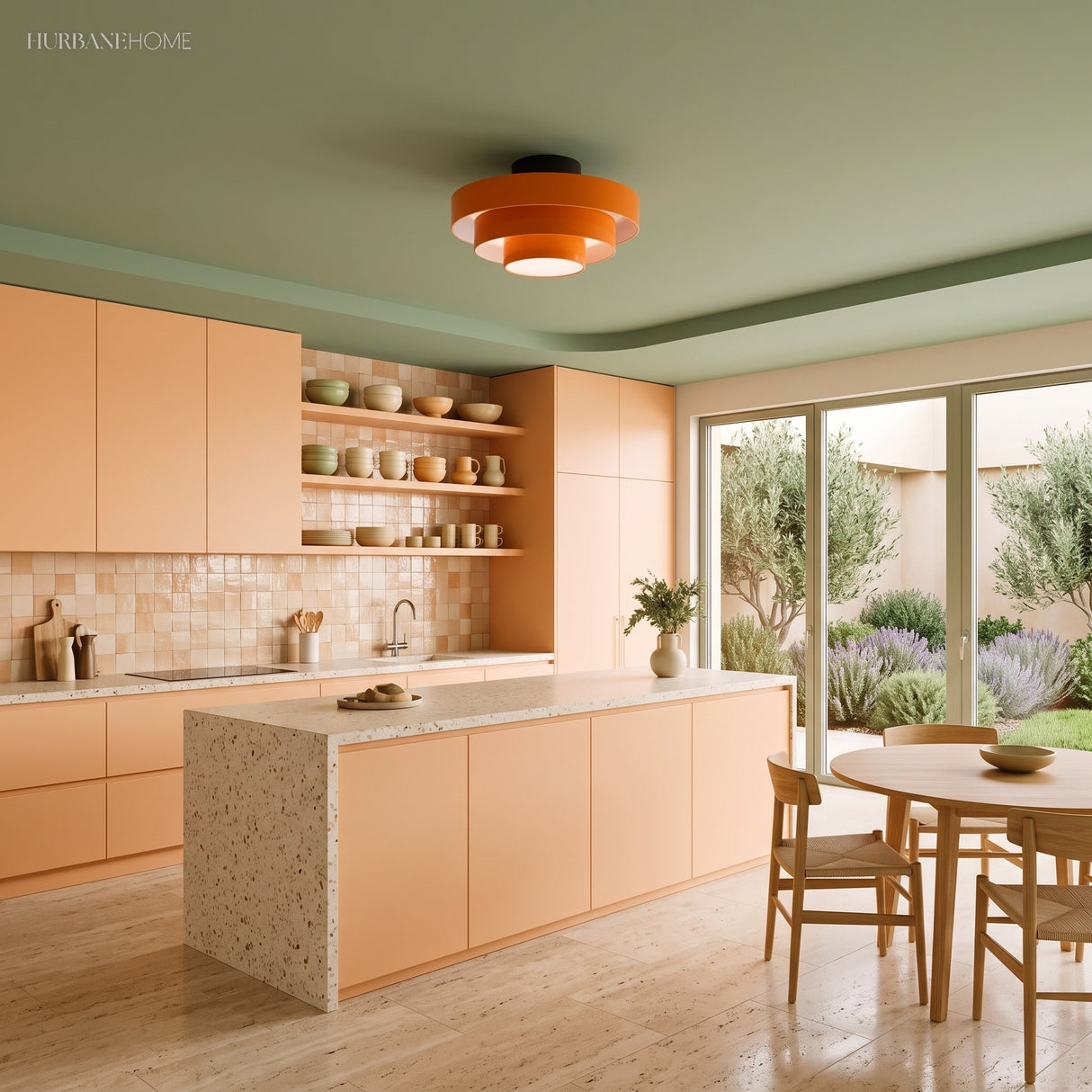 Orange tiered ceiling light in a peach kitchen with sage green ceiling
