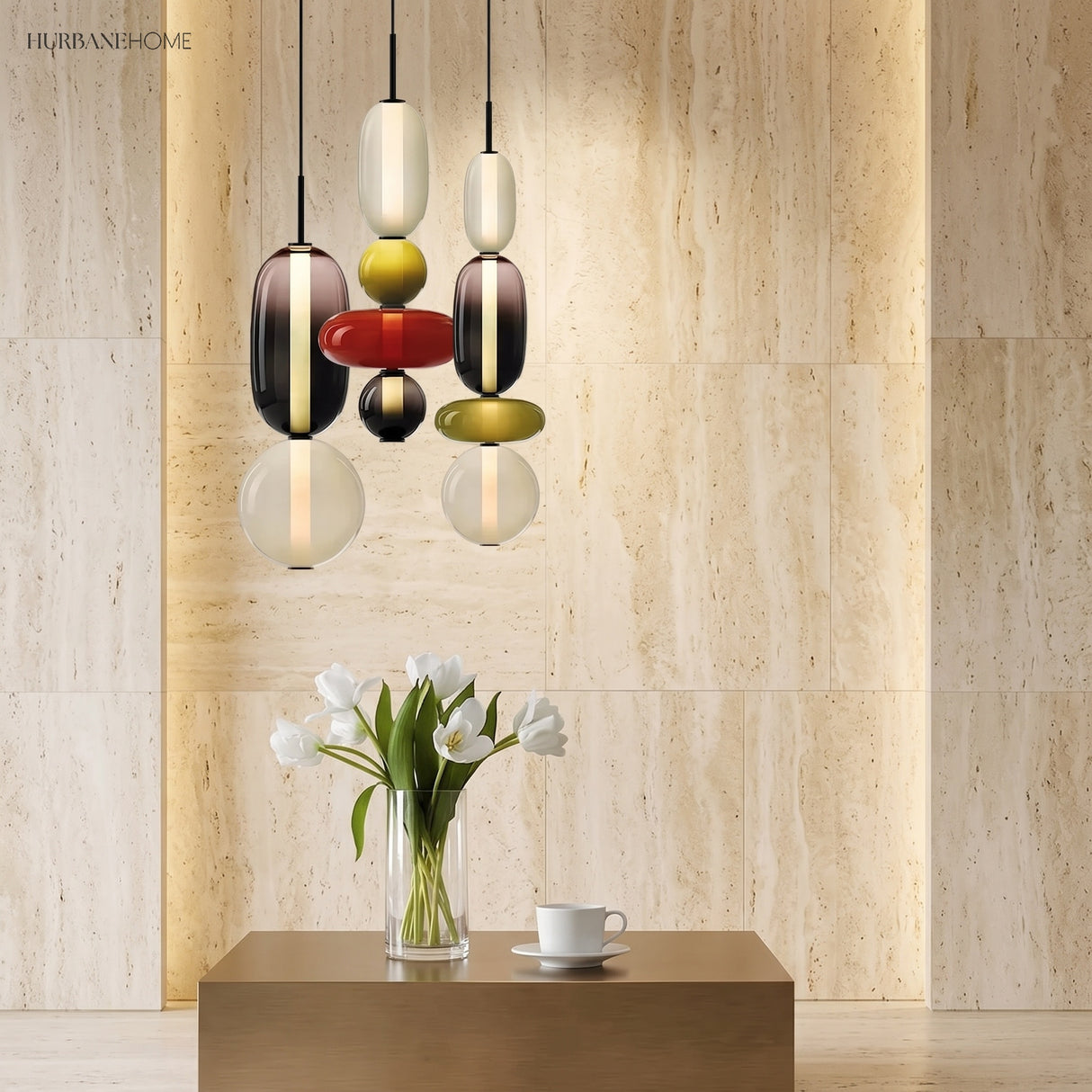 Colorful glass pendant light with red disc above a home office desk
