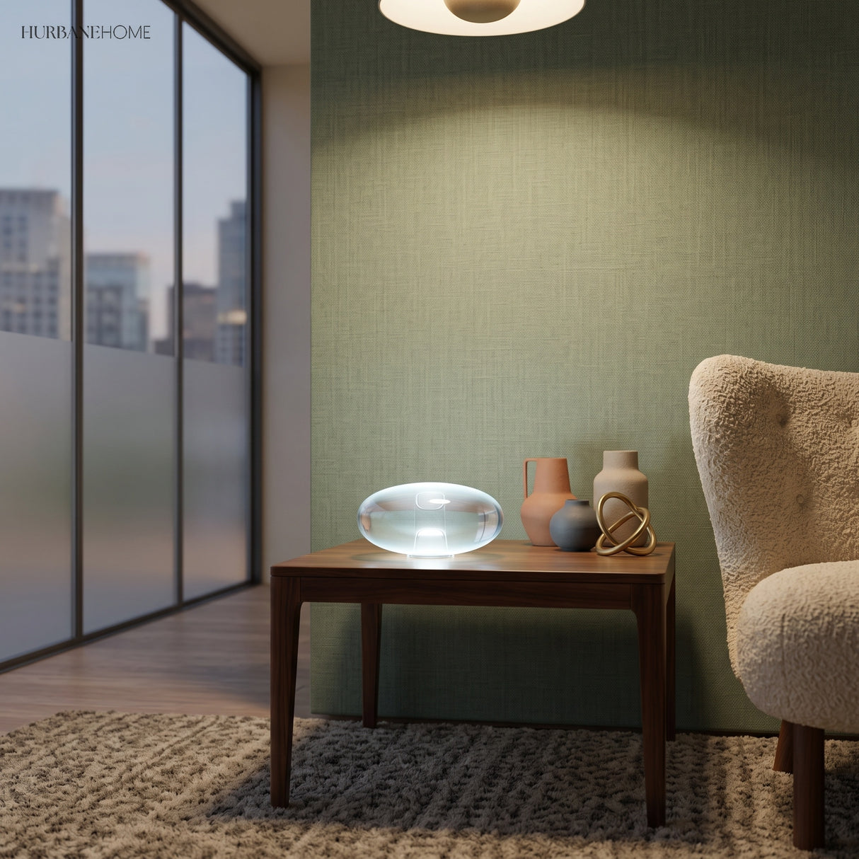 Oval glass lamp glowing softly on a side table in green room