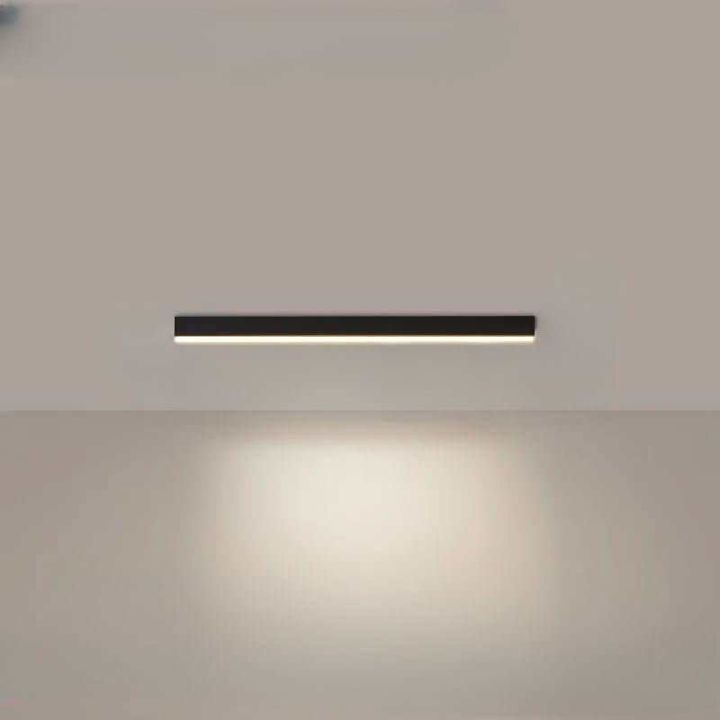 Black linear LED ceiling bar photographed against a pale ceiling