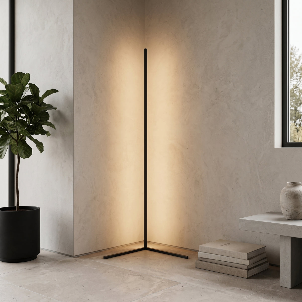 Black minimalist corner floor lamp glowing warmly beside a potted plant and low bench