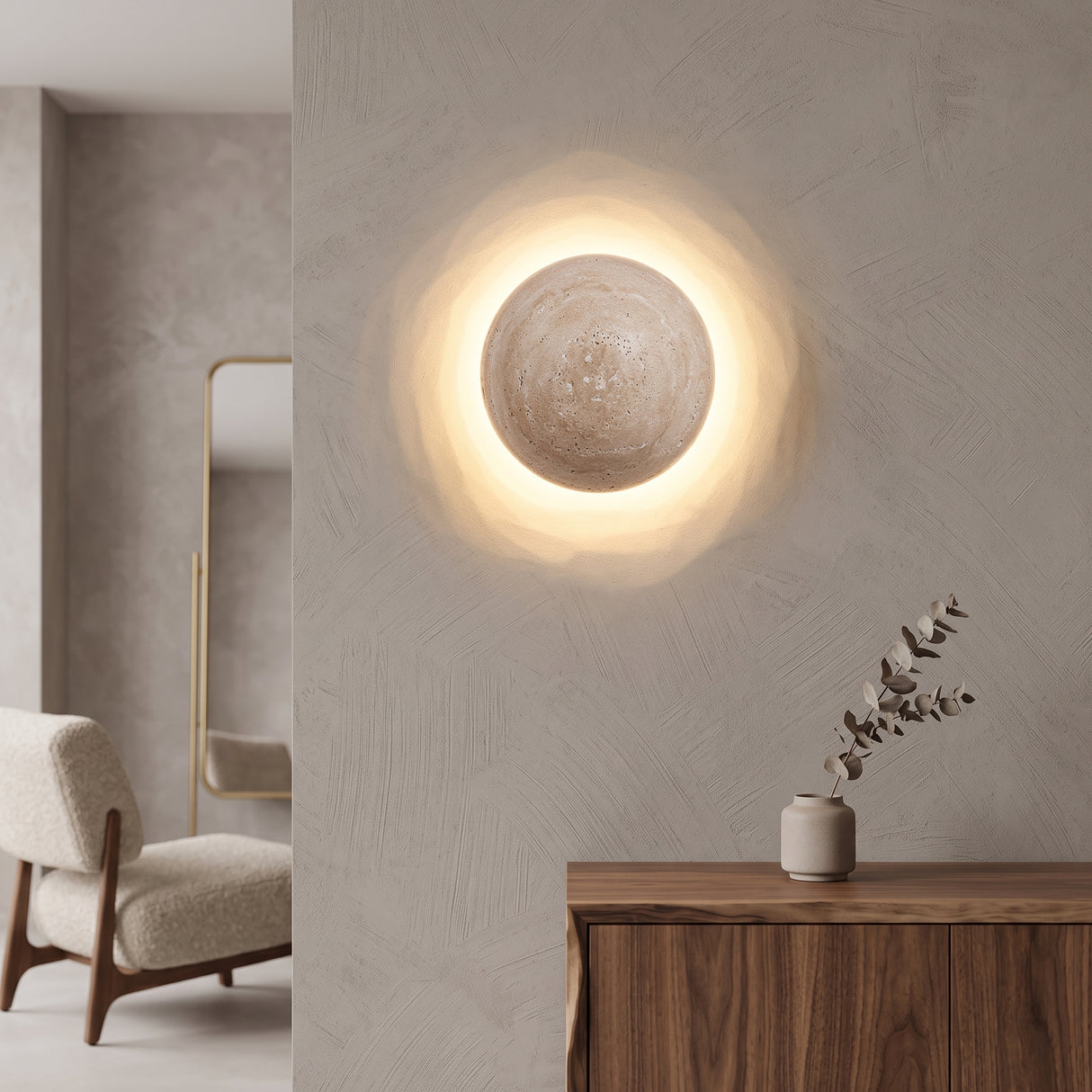Round travertine stone LED wall sconce glowing warm on a plain wall