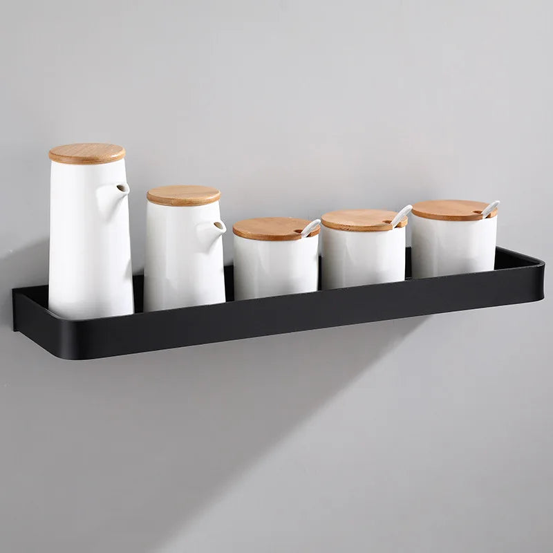 Wall-installed bathroom corner storage rack holding toiletries