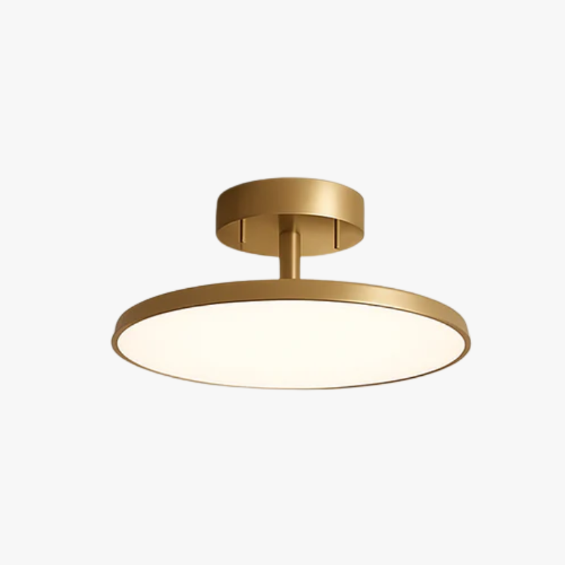 Gold disc ceiling light shown against a plain white backdrop