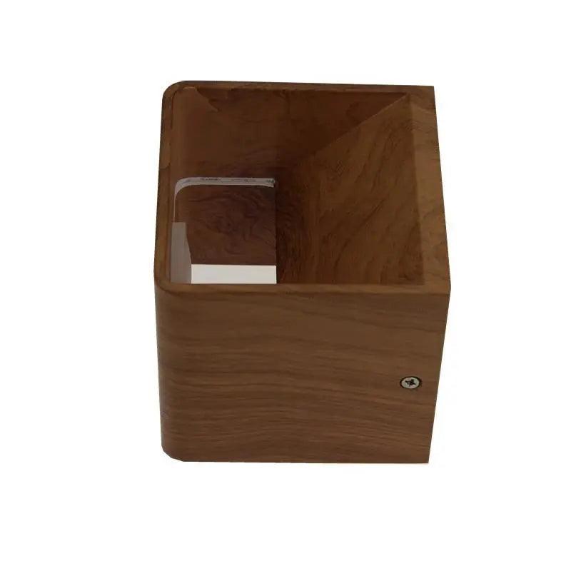 Wood cube sconce seen from the side showing the open faces