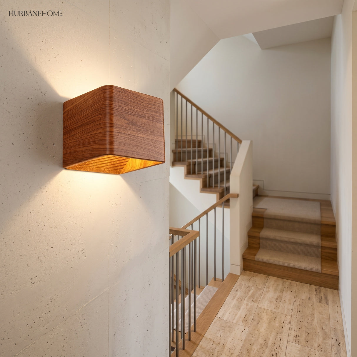 Wood cube wall sconce lit on a wall beside a staircase