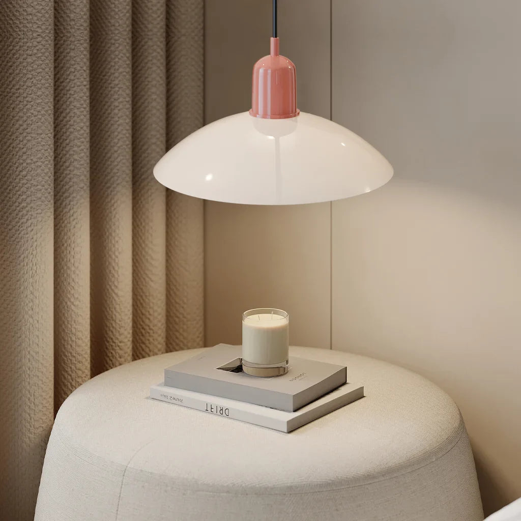 Angled view of modern disc pendant light and its central globe