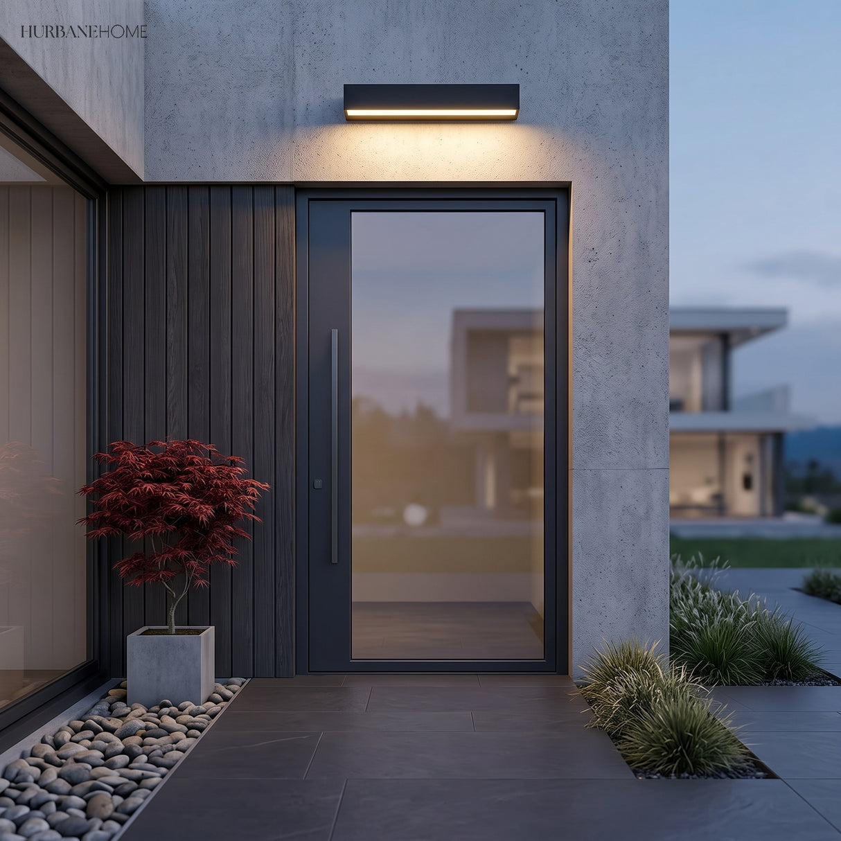 Black bar light mounted above a modern front door and glazing