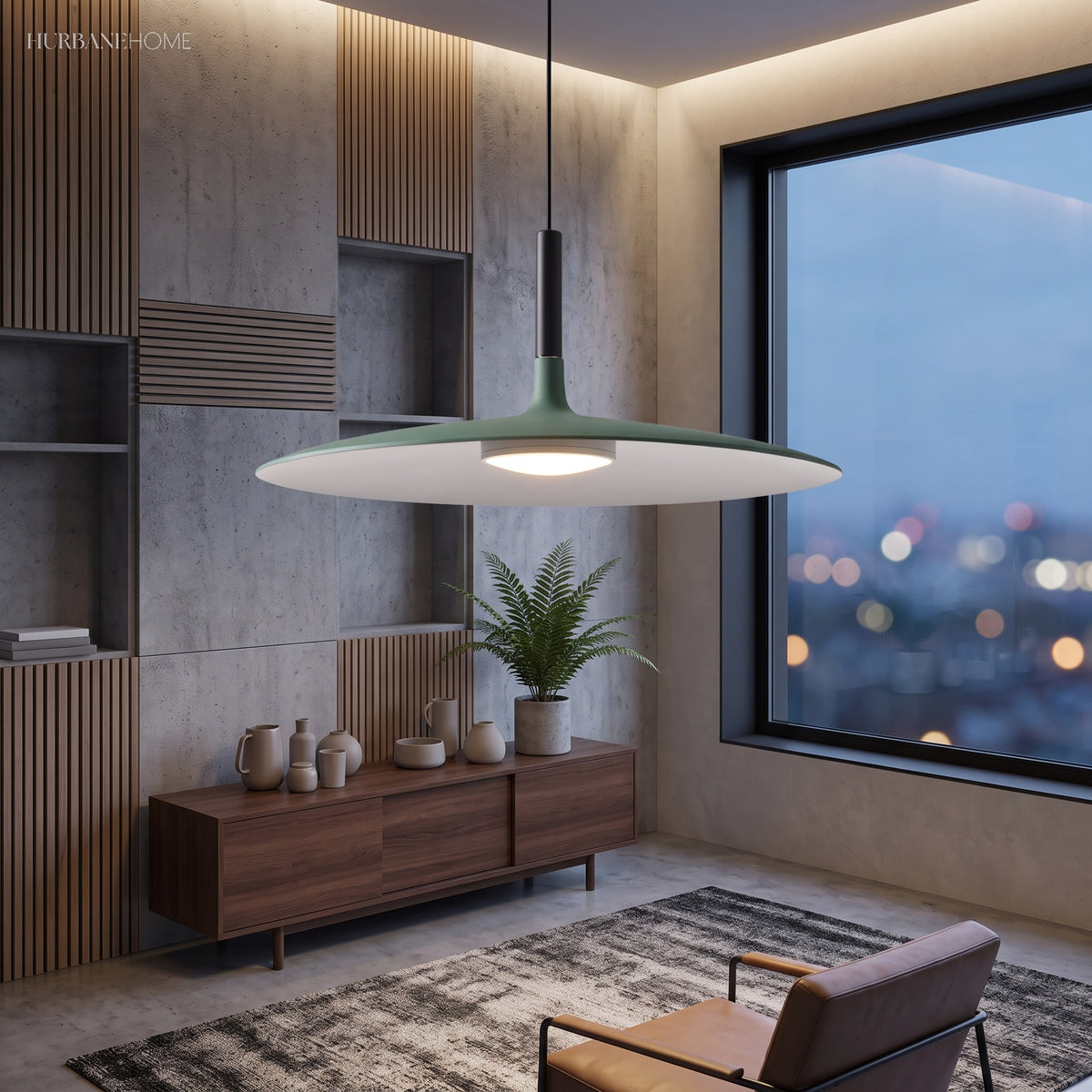 Green saucer pendant lit above a sideboard by a city window