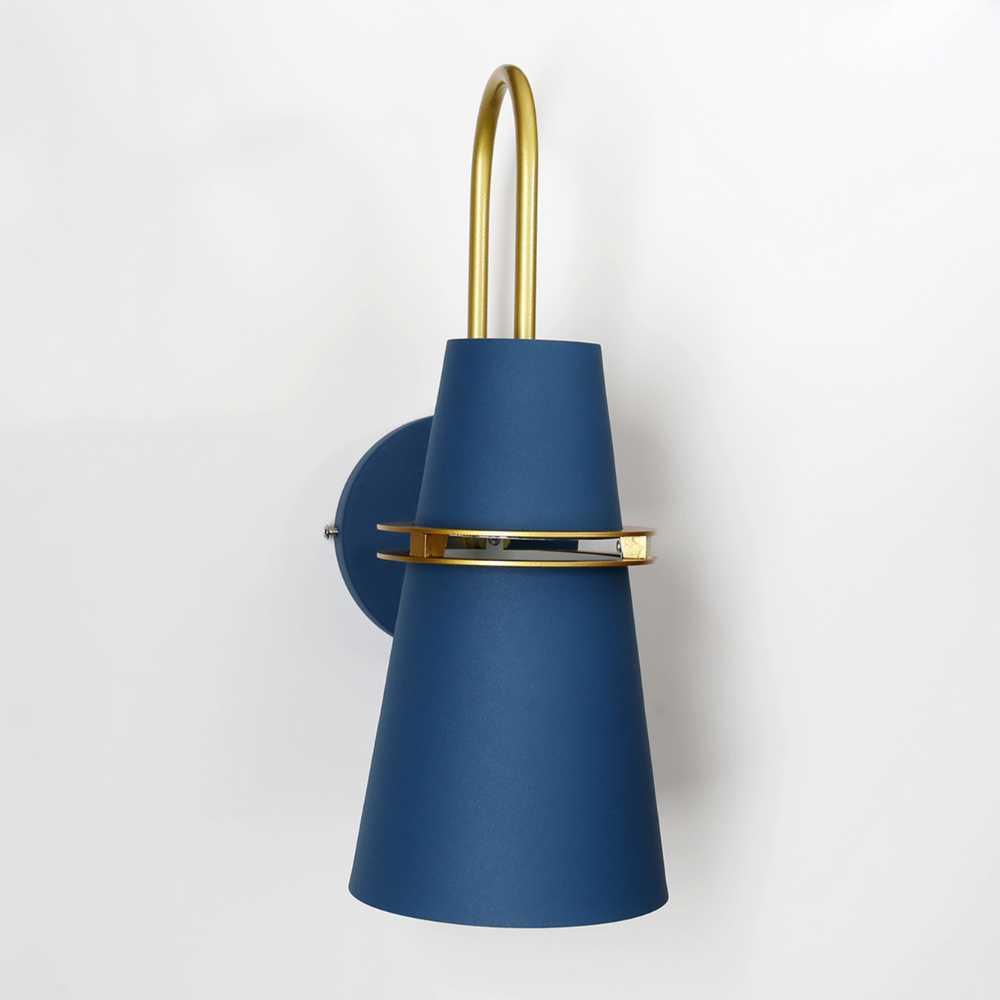 Blue cone sconce seen at an angle showing the brass ring band