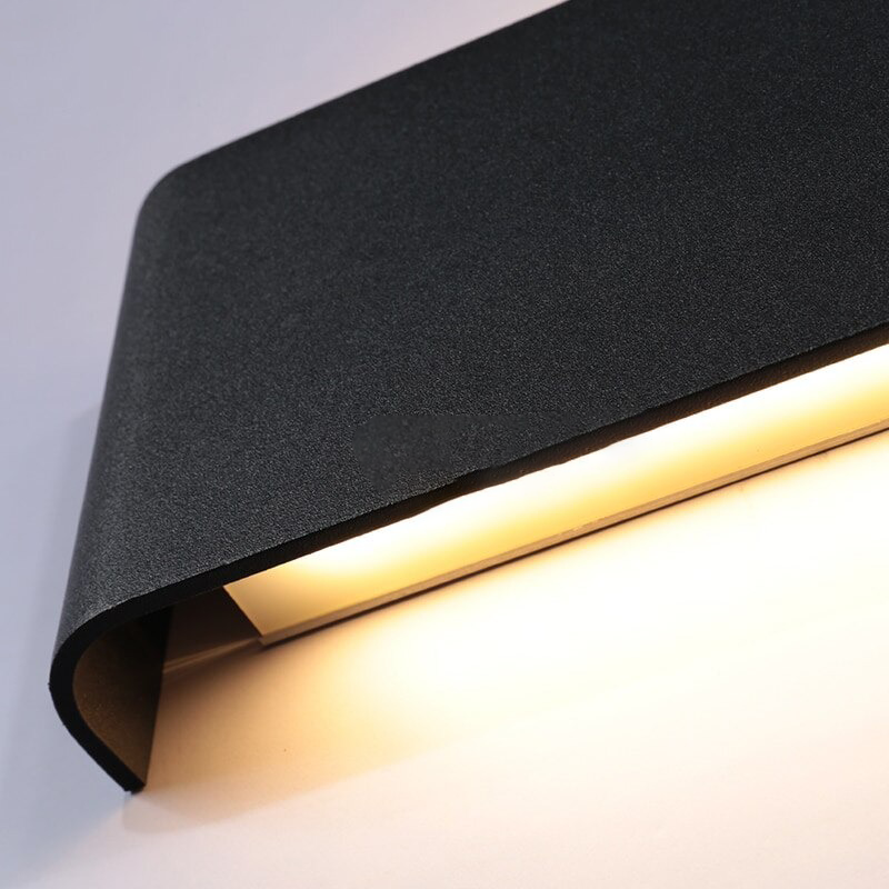 Close view of the folded metal edge with the LED glowing inside