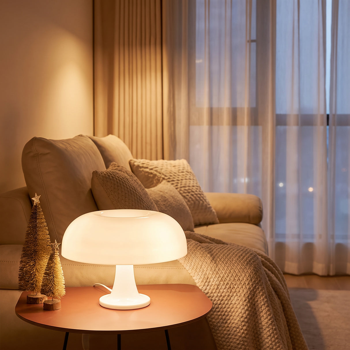 White mushroom table lamp lit on a side table next to a linen sofa
