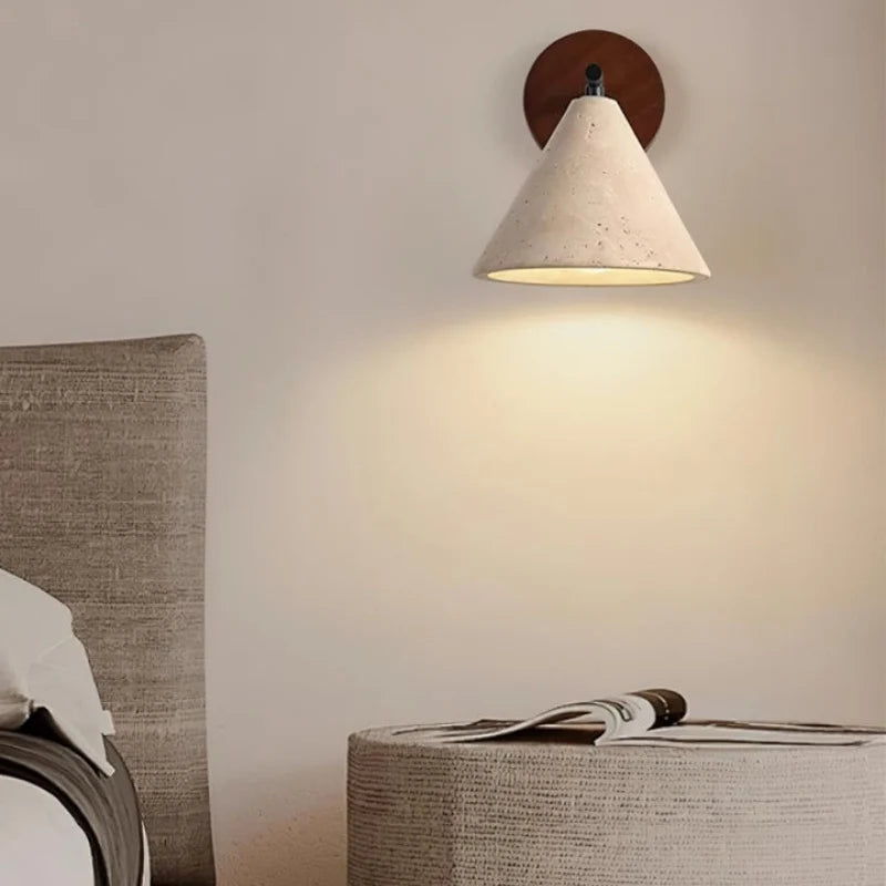 Natural stone wall sconce with round wood backplate detail