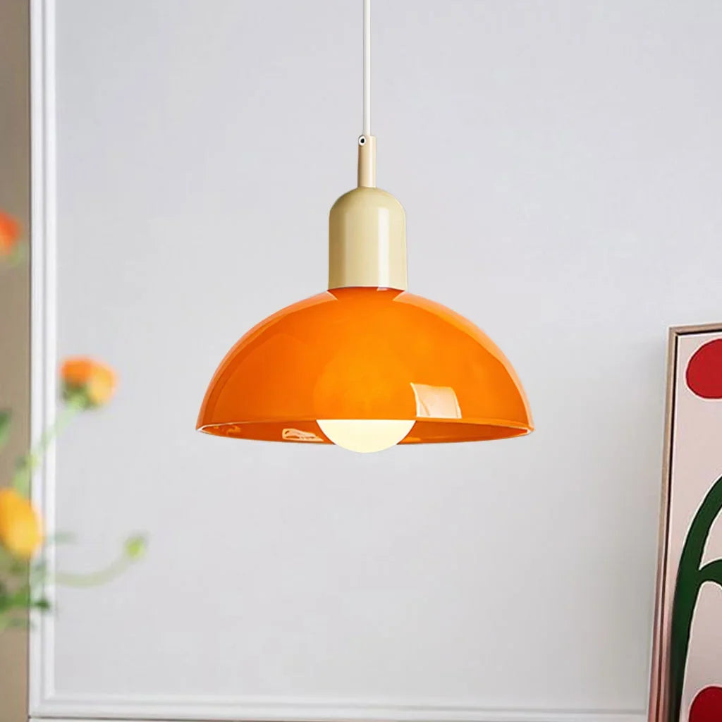 Orange shade bowl pendant light with a coloured metal cap swatch