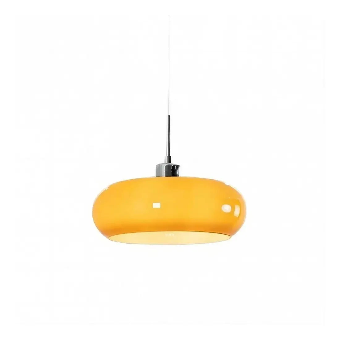 Orange glass pendant light on a thin cord photographed on a white background