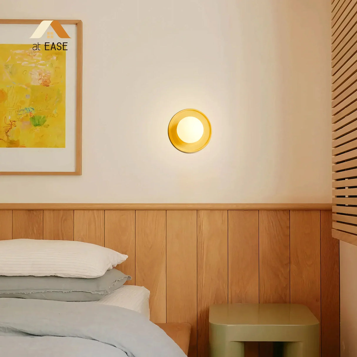 Blue orb wall sconce beside a yellow one comparing the two colour options