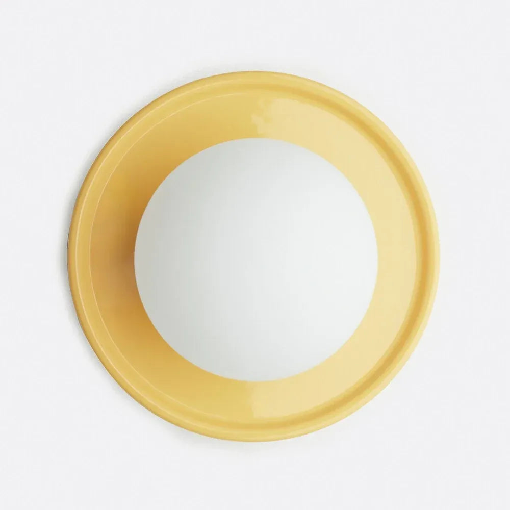 Orb wall sconce switched off showing the plain frosted glass globe