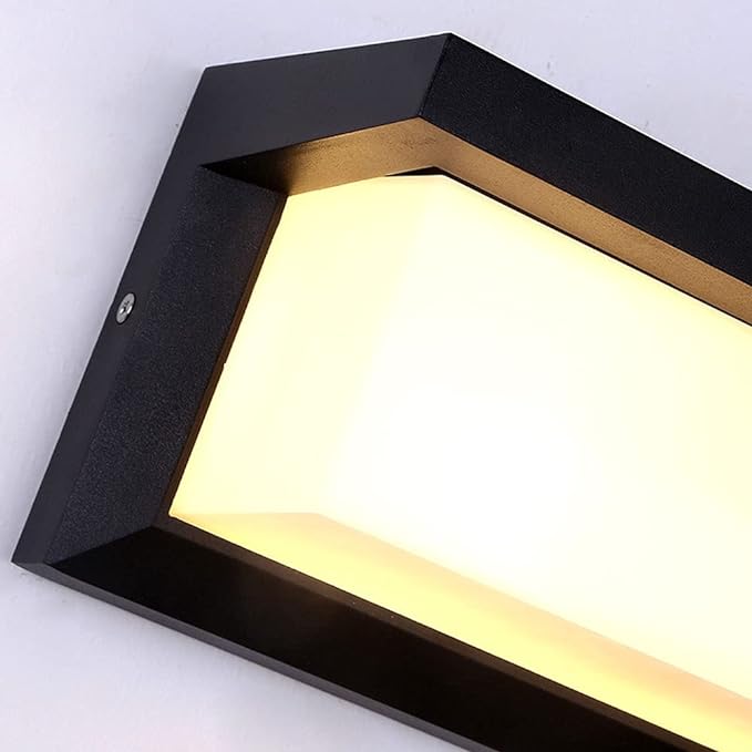 Close view of the angled black housing and its wide frosted diffuser