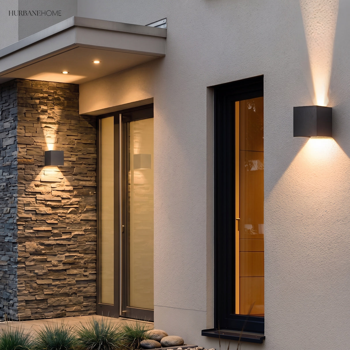 Cube sconce lighting a timber clad wall beside a doorway