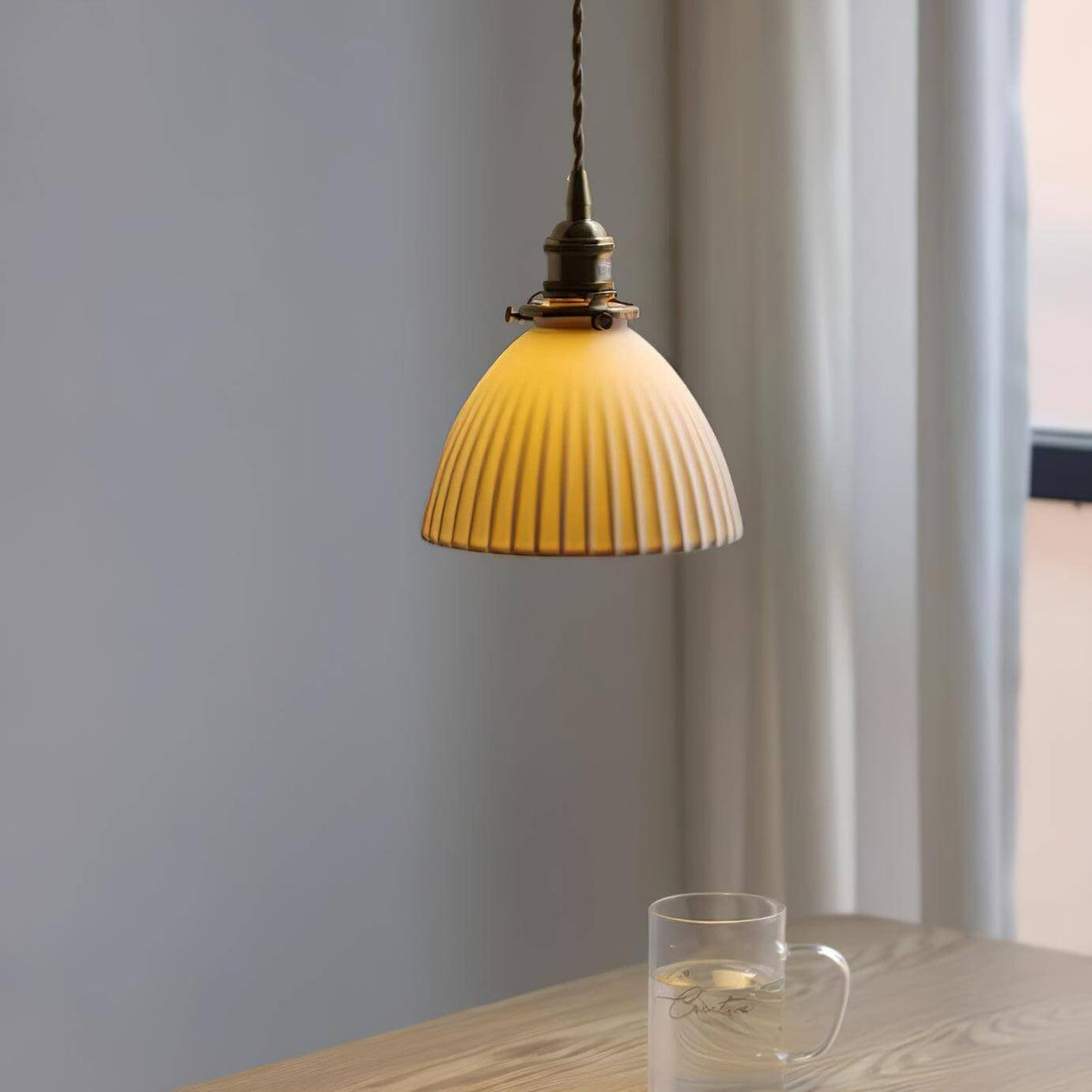 Ceramic pendant with deep pleats and a twisted fabric cord, view 2
