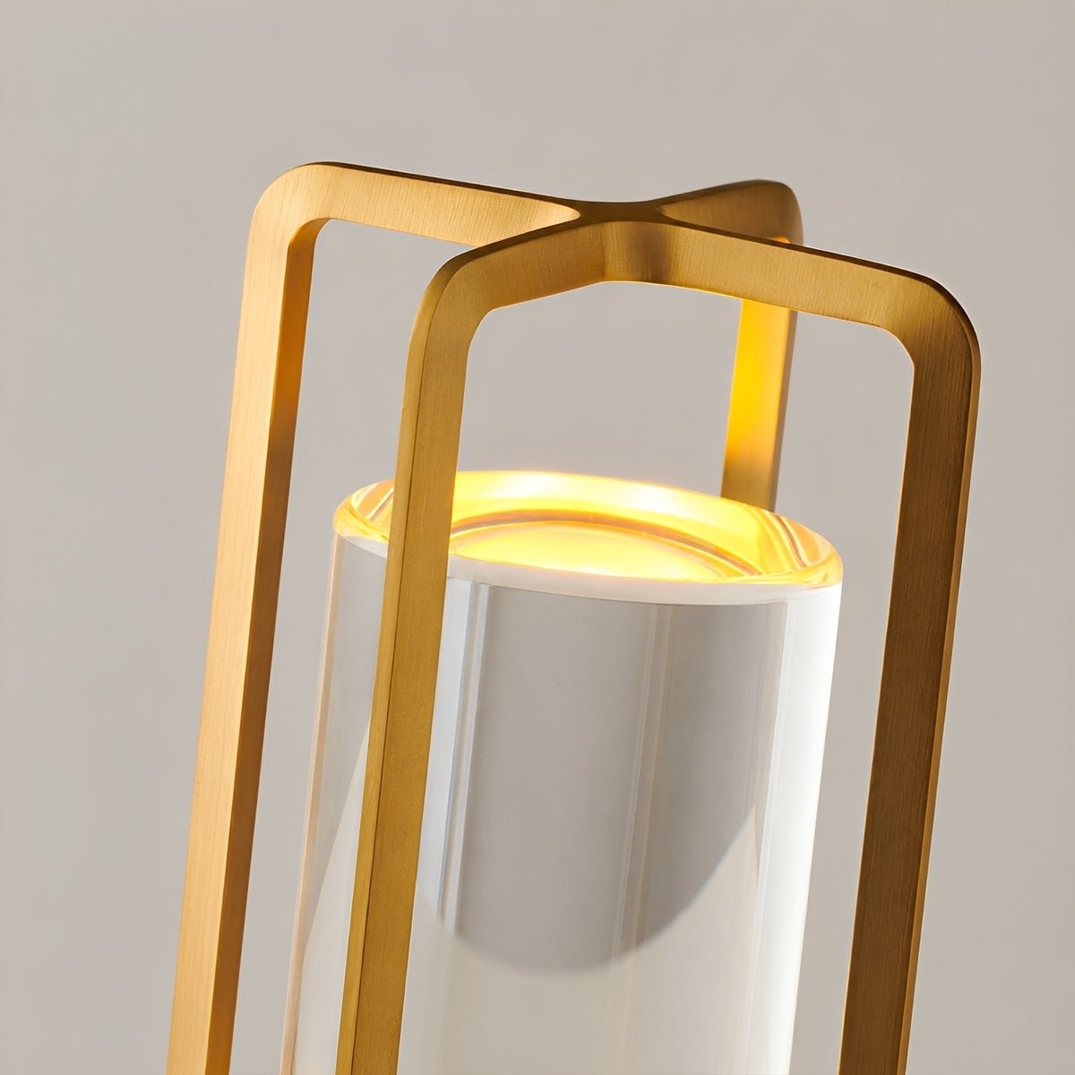 Detail of the gold handle frame around the frosted acrylic cylinder