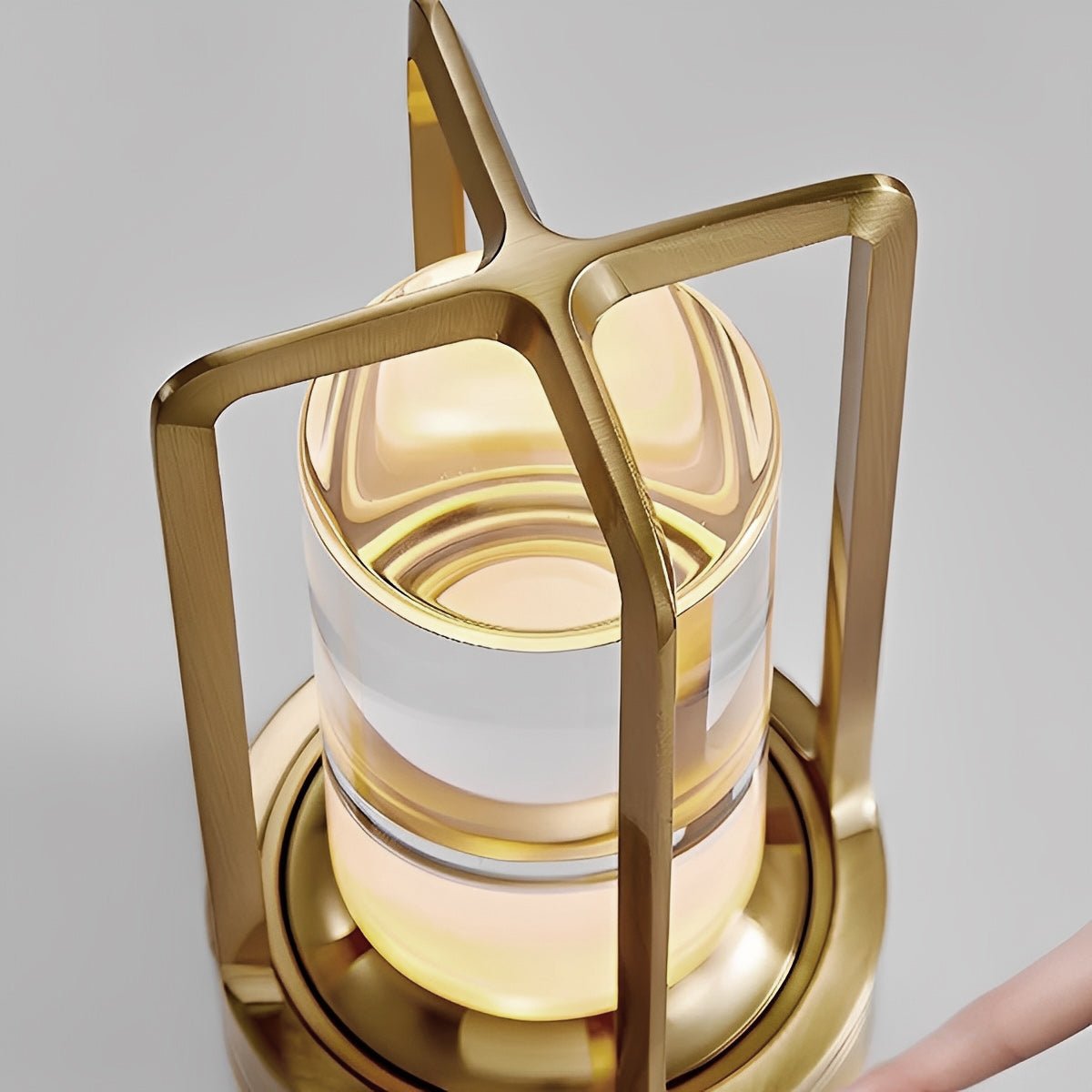 Angled studio view of the gold lamp showing the squared carry handle