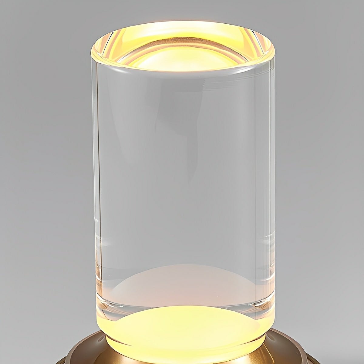 Close up of the clear acrylic tube lit warm from the base below