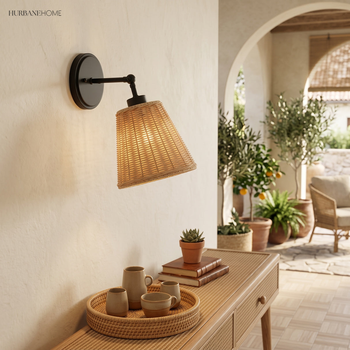 Black arm rattan sconce on a wall beside an arched garden doorway